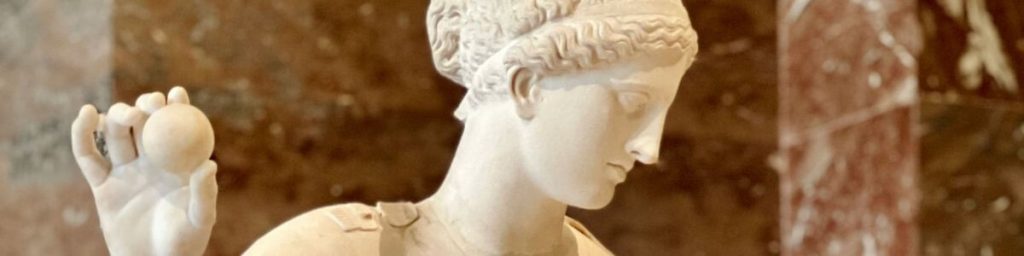 Ancient statue of a woman holding a small sphere, symbolizing mindful control and focus.